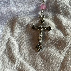 Jesus on a cross pink necklace